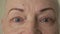 Face and eyes 60 year old bald woman. Depression and stress caused by serious illness or problems. Close-up. Close-up.