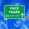 FACE FEARS road sign against clear blue sky