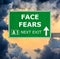 FACE FEARS road sign against clear blue sky