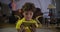 Face of focused Caucasian boy watching cartoons or movie on smartphone screen. Child with curly hair absorbed by