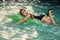 Face girl for magazine cover. Girl face portrait in your advertisnent. beautiful slim girl in a swimsuit. Floating on a