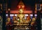 Face of golden Buddha, golden image of Buddha inside the temple