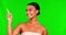 Face, green screen and woman with lotion, pointing and selection with salon treatment, grooming and beauty. Portrait