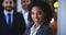 Face, leadership and black woman in business with team in office, company or workplace at night. Portrait, employee