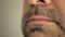 Face, lips of a man with a gray beard. Super macro close-up.