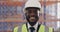 Face, man and logistics worker with happy in factory with experience and safety gear. African person, engineer or