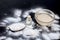 Face mask or face pack of baking soda in a glass bowl on wooden surface along with powder and some coconut oil in a transparent