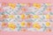 Face mask flower pattern on light pink background