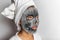 Face mask foam bubbles charcoal detox facial treatment at home -asian girl purifying skin removing dead skin