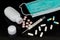 Face mask, mercury thermometer and different pills with bottle