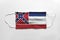 Face mask with Mississippi flag printed, on white background, isolated