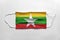 Face mask with Myanmar flag printed, on white background, isolated