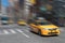 Face moving taxi cab motion blur background in New York City