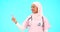 Face, nurse and Muslim woman pointing to mockup in studio isolated on a blue background. Portrait, healthcare