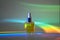 Face oil in front of rainbow