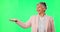 Face, old woman and hand presentation on green screen in studio isolated on a background. Portrait, palm space and funny