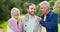 Face, outdoor and senior parents with son, having fun and bonding together. Portrait, family and elderly mother and