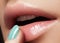 Face part. Beautiful female lips with natural makeup, clean skin. Macro shot of female lip, clean skin. Fresh kiss. Spa beauty cos