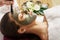 Face peeling mask, spa beauty treatment, skincare. Woman getting facial care by beautician at spa salon,  close-up.Spa clay mask o