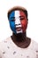 Face portrait of afro fan support France national team with painted face isolated on white background