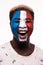 Face portrait of happy afro fan support France national team with painted face isolated on white background