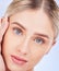 Face portrait, skincare and beauty of woman in studio isolated on a blue background. Makeup cosmetics, aesthetic closeup