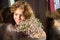 face portrait of smiling adorable teenage girl with bouquet of gypsophila flowers