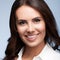 Face portrait studio image of happy smiling young brunette businesswoman in confident white clothing, over grey color background.