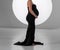without a face. a pregnant woman in a black tight dress.