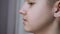 Face Profile of a Talking Displeased Teenager Moving his Lips. 4K. Close-up