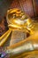 Face of Reclining Buddha gold statue in Wat Pho buddhist temple
