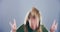 Face, rock and roll with woman, dancing and happiness with heavy metal music on a grey studio background. Portrait