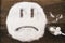 Face of a sad smiley made with granulated sugar