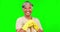 Face, senior woman and cleaner, green screen and happy housekeeper with broom and gloves on studio background. Cleaning