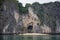 Face-shaped cave with a small beach inside limestone rocks