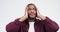 Face, shock and black man with stress, confused and model with facial expression on white studio background. African