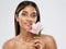 Face Skin Care. Beauty Indian Model smelling Lotus Flower. Beautiful Woman Portrait with Natural Make up and smooth Skin