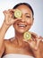 Face, skincare and senior woman with kiwi in studio isolated on a white background. Food, natural fruit and portrait of