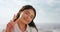 Face, smile or happy woman with peace sign at beach in summer morning for freedom, vacation or holiday. Portrait