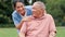 Face, smile and nurse with old man at park for healthcare, rehabilitation and support. Portrait, caregiver and happy