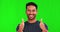 Face, thumbs up and happy man in green screen studio background with hand, like sign and thank you. Smile, portrait and