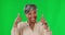 Face, thumbs up and senior woman on green screen for agreement, good job and promotion in studio. Emoji mockup, happy