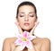 Face of woman with flower. Beauty treatment