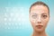  face of young beautiful woman with hi-tech laser eye surgery concept