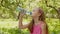 Face of young girl drink water bottle at summer green park