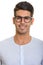 Face of young happy Persian man smiling with eyeglasses