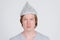 Face of young man with tinfoil hat as conspiracy theory concept