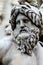 Face of Zeus in Piazza Navona fountain, Rome Italy