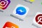 Facebook messenger application icon on Apple iPhone X screen close-up. Facebook messenger app icon. Online internet social media