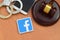 Facebook paper logo lies with wooden judge gavel, smartphone and handcuffs. Entertainment lawsuit concept